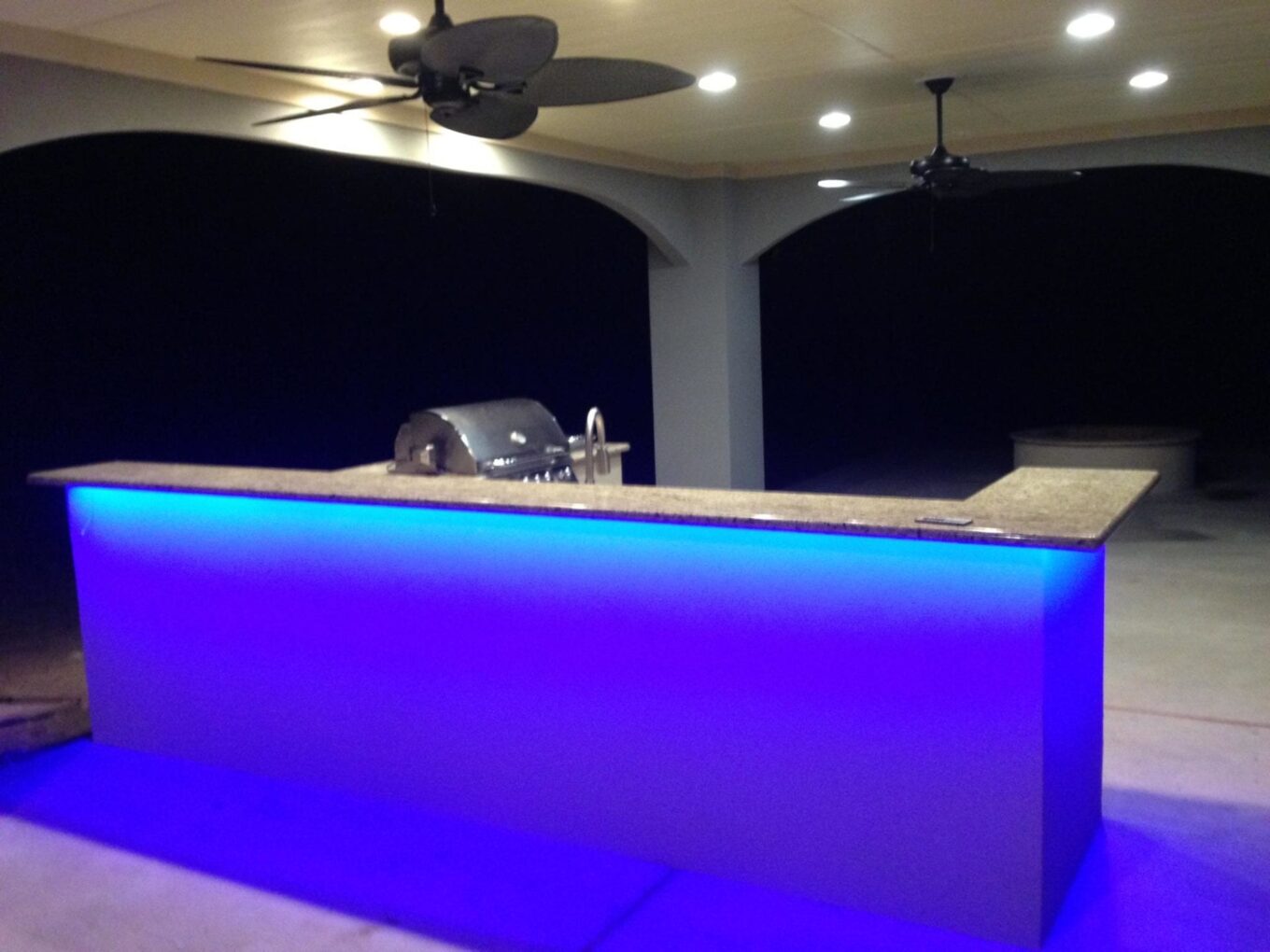A bar with blue lights in the middle of it.