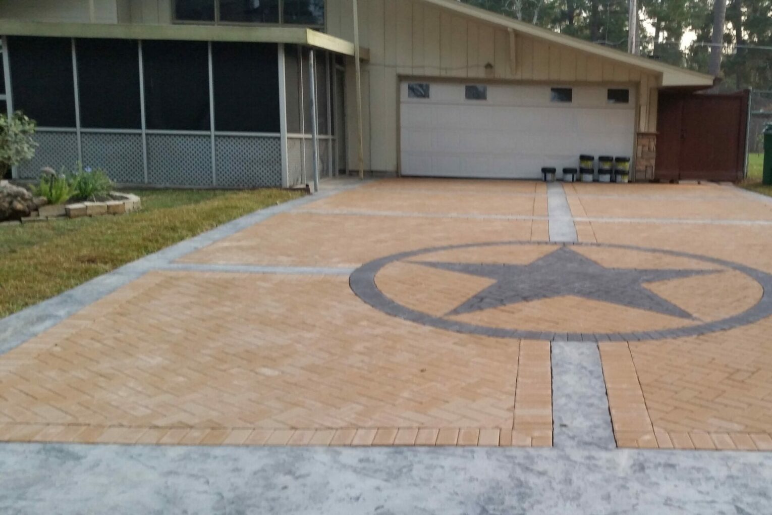 A large concrete driveway with a star on it.